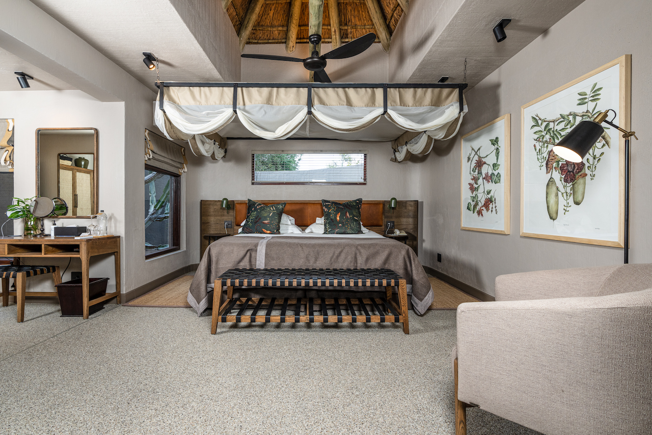 <p>The Suites at Sabi Sabi Bush Lodge are spacious and beautifully decorated with African-inspired furnishings and decor. Each room is equipped with modern amenities, including air conditioning, ceiling fans, and en-suite bathrooms with both indoor and outdoor showers.</p>  <p>The rooms also feature private decks with stunning views of the surrounding bushveld, providing guests with the opportunity to spot wildlife from the comfort of their own room.</p>  <p>Overall, the bedrooms at Sabi Sabi Bush Lodge offer a luxurious and unforgettable safari experience.</p>